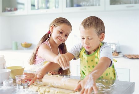 fun with flour - Children making biscuits Stock Photo - Premium Royalty-Free, Code: 614-00653936