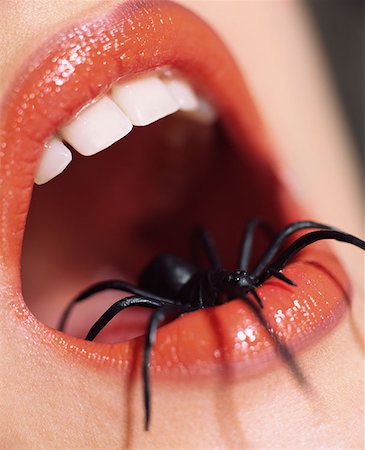 Woman with spider in her mouth Stock Photo - Premium Royalty-Free, Code: 614-00683986