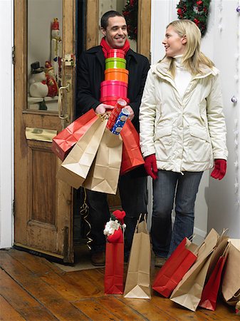 simsearch:846-05648541,k - Couple returning home from christmas shopping Stock Photo - Premium Royalty-Free, Code: 614-00892900