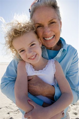Grandmother and granddaughter posing on beach Stock Photo - Premium Royalty-Free, Code: 614-01026990