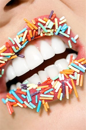 Woman with sugar sprinkles on her lips Stock Photo - Premium Royalty-Free, Code: 614-01088592