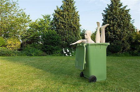 Mannequin in a wheelie bin Stock Photo - Premium Royalty-Free, Code: 614-01170480