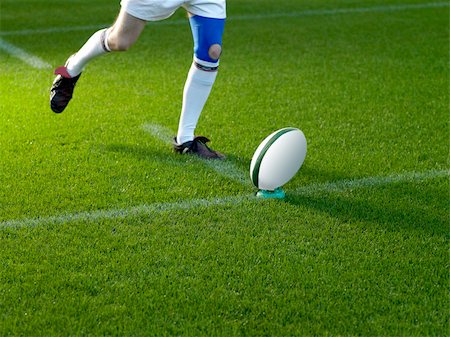 simsearch:614-00657328,k - Rugby player kicking ball Stock Photo - Premium Royalty-Free, Code: 614-01435549