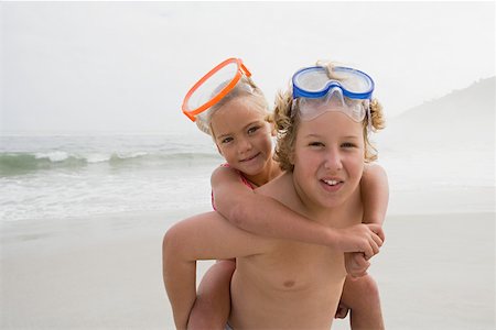 piggyback brothers - Boy and girl by the sea Stock Photo - Premium Royalty-Free, Code: 614-01624514