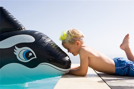 snorkeler (male) - Boy with inflatable whale Stock Photo - Premium Royalty-Free, Code: 614-01624529