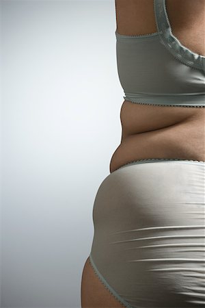 pot belly - Woman in underwear Foto de stock - Sin royalties Premium, Código: 614-01700713