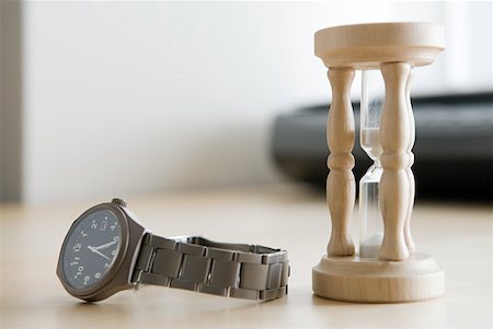 An hourglass and a watch Stock Photo - Premium Royalty-Free, Code: 614-01819577