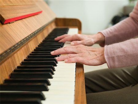 Senior woman playing the piano Stock Photo - Premium Royalty-Free, Code: 614-01821898