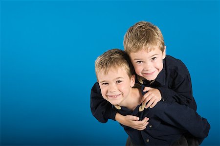 piggyback brothers - Twin boys Stock Photo - Premium Royalty-Free, Code: 614-02004494