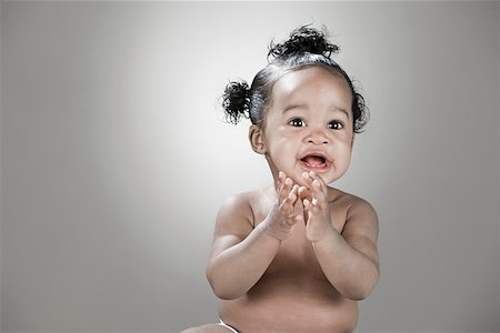 A baby girl clapping Stock Photo - Premium Royalty-Free, Code: 614-02050214