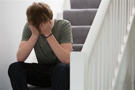 A teenage boy crying Stock Photo - Premium Royalty-Free, Code: 614-02244197