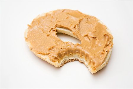 A bagel with a missing bite Stock Photo - Premium Royalty-Free, Code: 614-02240522