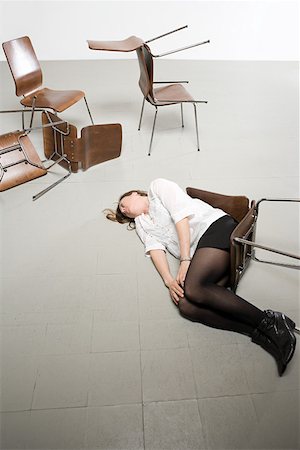 dead woman - Woman and chairs on floor Stock Photo - Premium Royalty-Free, Code: 614-02243065