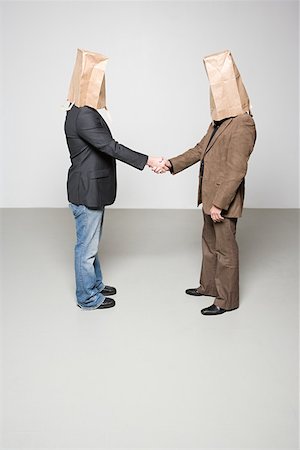 Men with paper bags on their heads Stock Photo - Premium Royalty-Free, Code: 614-02243076