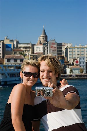 Couple photographing themselves in galata Stock Photo - Premium Royalty-Free, Code: 614-02258074