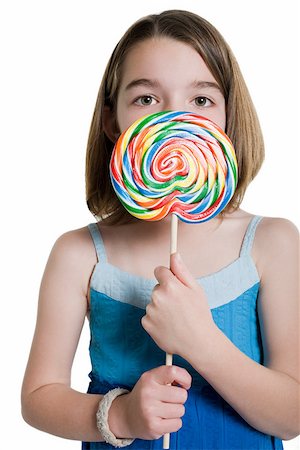 Girl holding a lollipop Stock Photo - Premium Royalty-Free, Code: 614-02258118