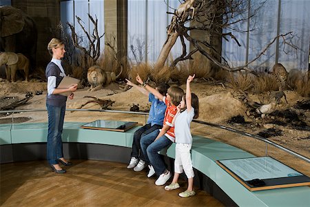 Children and a teacher at a museum Stock Photo - Premium Royalty-Free, Code: 614-02344389