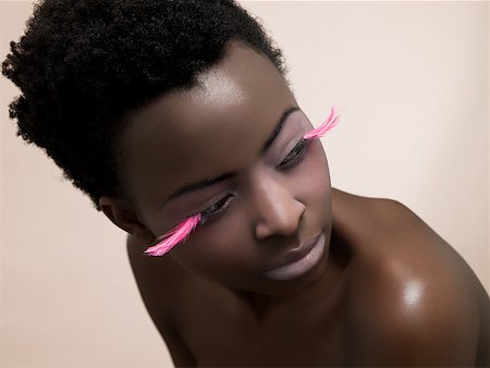 false eyelashes - A woman wearing pink false eyelashes Stock Photo - Premium Royalty-Free, Code: 614-02343576