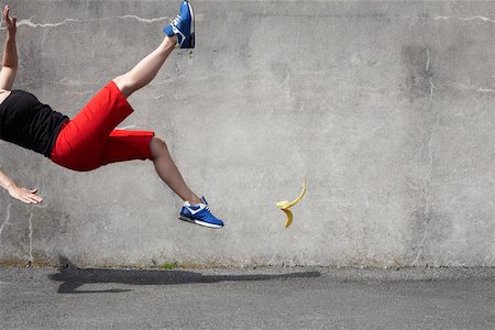 people falling - Woman falling on a banana skin Stock Photo - Premium Royalty-Free, Code: 614-02343921