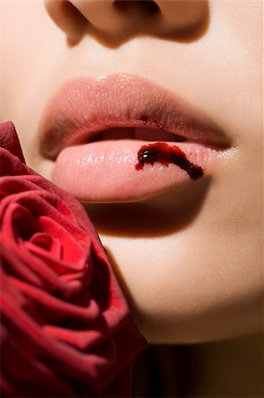 A woman with a bleeding lip Stock Photo - Premium Royalty-Free, Code: 614-02392247