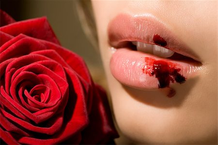 A woman with a bleeding lip Stock Photo - Premium Royalty-Free, Code: 614-02392248