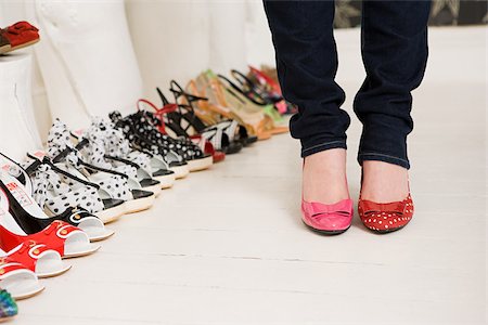 Woman shopping for shoes Stock Photo - Premium Royalty-Free, Code: 614-02392322