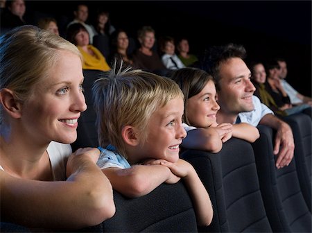 A family watching a movie Stock Photo - Premium Royalty-Free, Code: 614-02392960