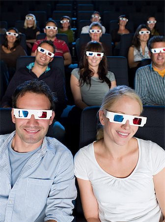 retro movies - A cinema audience watching a 3d movie Stock Photo - Premium Royalty-Free, Code: 614-02392997