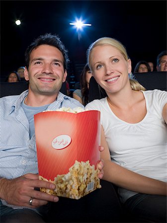 A couple watching a movie Stock Photo - Premium Royalty-Free, Code: 614-02393004