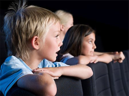 Children watching a movie Stock Photo - Premium Royalty-Free, Code: 614-02393036