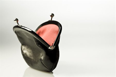 Empty purse Stock Photo - Premium Royalty-Free, Code: 614-02393201