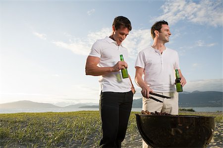 drinking beer outside - Men barbecuing on an island Stock Photo - Premium Royalty-Free, Code: 614-02611781