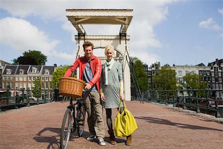 person in a basket of a bike - Couple in amsterdam Stock Photo - Premium Royalty-Free, Code: 614-02613328