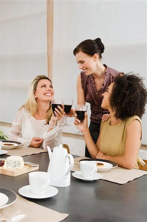 Friends having red wine at a dinner party Stock Photo - Premium Royalty-Free, Code: 614-02613370