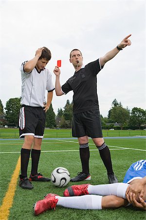 referee (male) - Referee giving red card Stock Photo - Premium Royalty-Free, Code: 614-02639741
