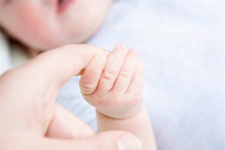 small hand big hand - Baby holding adult finger Stock Photo - Premium Royalty-Free, Code: 614-02639838