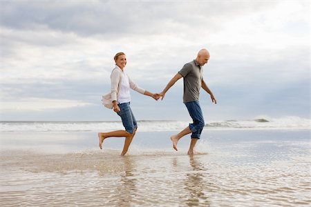 rolled up (closely coiled) - Couple in the sea Stock Photo - Premium Royalty-Free, Code: 614-02640394