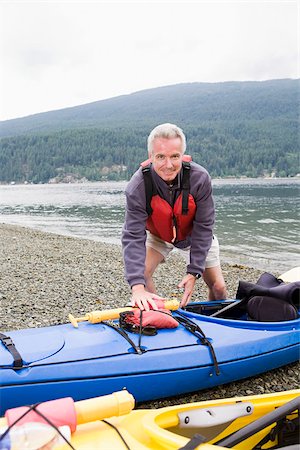 Man with kayak Stock Photo - Premium Royalty-Free, Code: 614-02679055