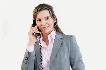 Businesswoman on telephone Stock Photo - Premium Royalty-Free, Code: 614-02679335