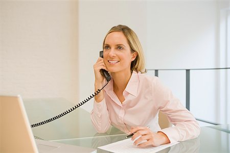 Office worker on telephone Stock Photo - Premium Royalty-Free, Code: 614-02680162