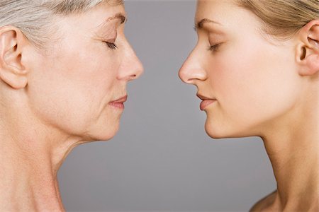 Young and senior women face to face Stock Photo - Premium Royalty-Free, Code: 614-02680362