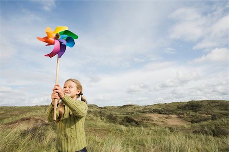 Girl with a pinwheel Stock Photo - Premium Royalty-Free, Code: 614-02680542