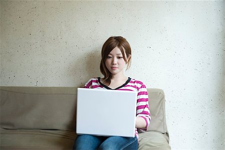 simsearch:614-02985267,k - Young woman with laptop Stock Photo - Premium Royalty-Free, Code: 614-02681101