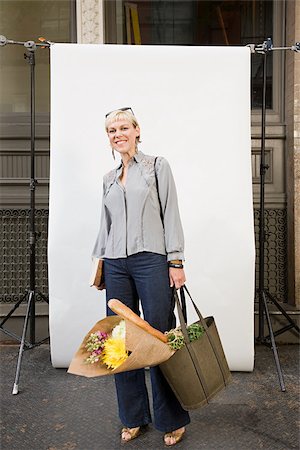 shopping bags city street - Woman in front of backdrop Stock Photo - Premium Royalty-Free, Code: 614-02739783