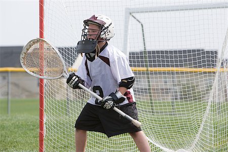 Junior lacrosse player in goal Stock Photo - Premium Royalty-Free, Code: 614-02764188