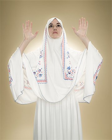 A young muslim woman praying Stock Photo - Premium Royalty-Free, Code: 614-02764181