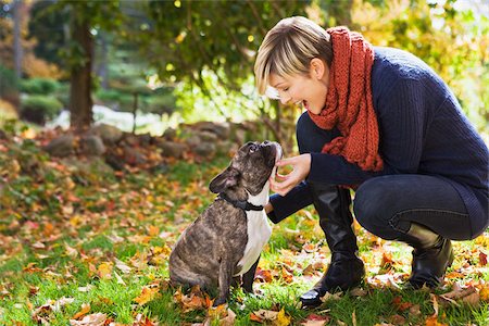 stroke - Young woman with pet dog Stock Photo - Premium Royalty-Free, Code: 614-02762837
