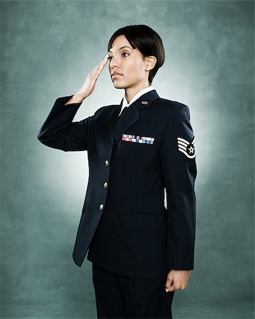 saluting - Portrait of an air woman saluting Stock Photo - Premium Royalty-Free, Code: 614-02763928