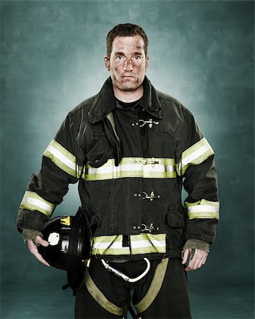 Portrait of a firefighter Stock Photo - Premium Royalty-Free, Code: 614-02763982