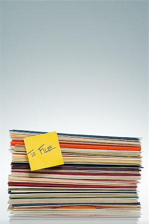 self adhesive note - Adhesive note on files Stock Photo - Premium Royalty-Free, Code: 614-02838757